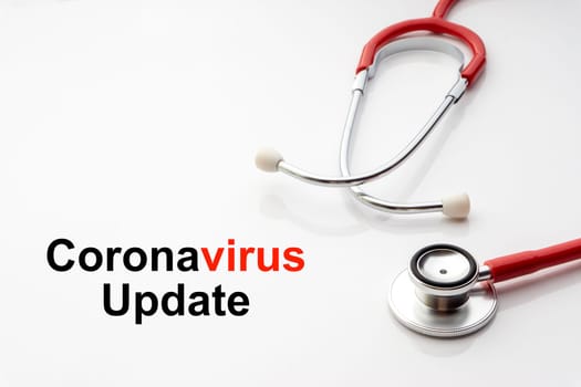 COVID-19 UPDATE text with stethoscope on white background. Covid or Coronavirus Concept
