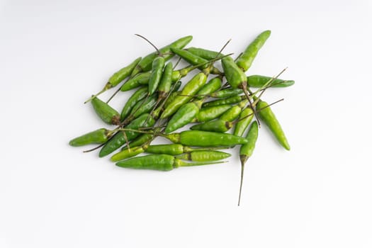 Green Bird’s eye chili,Thai Chili pepper ,bird chili pepper nature isolate on white background. Selective focus and crop fragment
