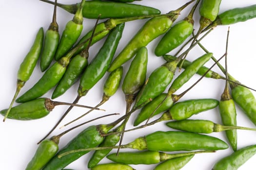 Green Bird’s eye chili,Thai Chili pepper ,bird chili pepper nature isolate on white background. Selective focus and crop fragment