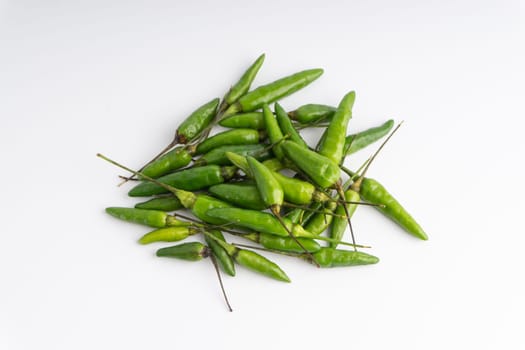Green Bird’s eye chili,Thai Chili pepper ,bird chili pepper nature isolate on white background. Selective focus and crop fragment