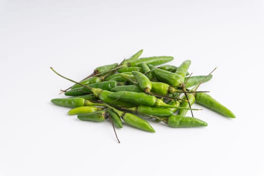 Green Bird’s eye chili,Thai Chili pepper ,bird chili pepper nature isolate on white background. Selective focus and crop fragment