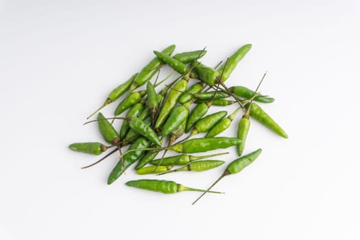 Green Bird’s eye chili,Thai Chili pepper ,bird chili pepper nature isolate on white background. Selective focus and crop fragment