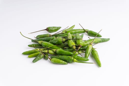Green Bird’s eye chili,Thai Chili pepper ,bird chili pepper nature isolate on white background. Selective focus and crop fragment