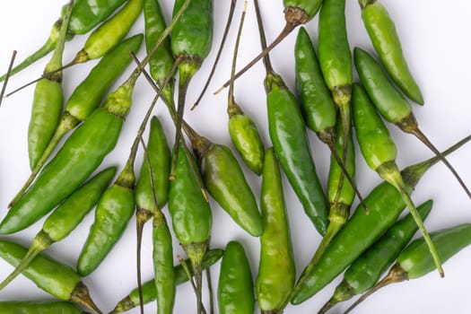 Green Bird’s eye chili,Thai Chili pepper ,bird chili pepper nature isolate on white background. Selective focus and crop fragment