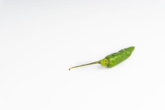 Green Bird’s eye chili,Thai Chili pepper ,bird chili pepper nature isolate on white background. Selective focus and crop fragment