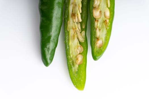 Green Bird’s eye chili,Thai Chili pepper ,bird chili pepper nature isolate on white background. Selective focus and crop fragment
