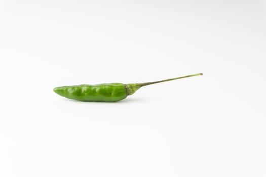 Green Bird’s eye chili,Thai Chili pepper ,bird chili pepper nature isolate on white background. Selective focus and crop fragment