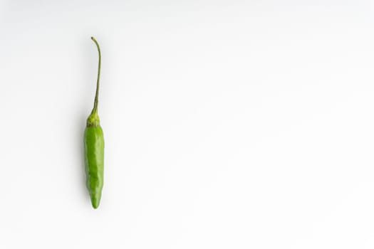 Green Bird’s eye chili,Thai Chili pepper ,bird chili pepper nature isolate on white background. Selective focus and crop fragment