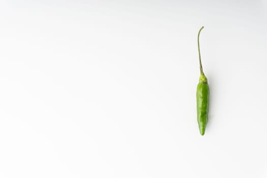Green Bird’s eye chili,Thai Chili pepper ,bird chili pepper nature isolate on white background. Selective focus and crop fragment