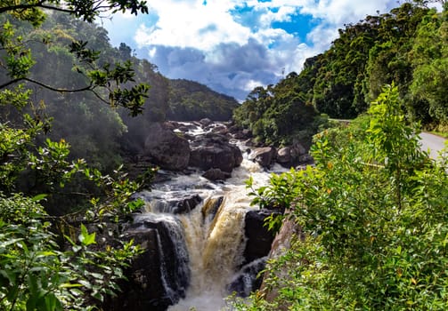 The boiling river with a waterfall in the rainforest