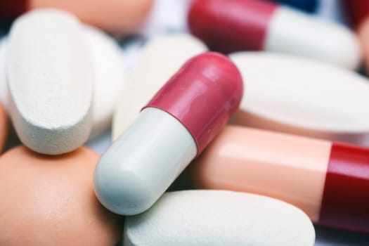 Pills close up over white
