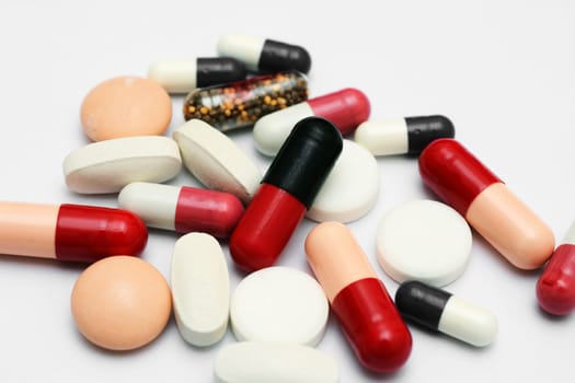 Pills close up over white