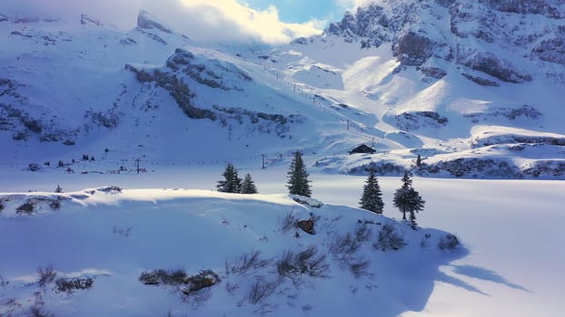Beautiful sunny winterÂ´s day in the alps with snow capped mountains - aerial drone footage - aerial photography
