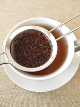 Honey bush tea in a tea sieve