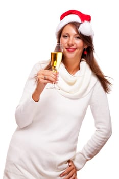 Attractive woman with red Santa hat holds a glass of champagne in her hand and smiles isolated on white background freeing text space