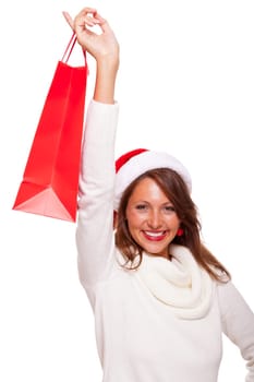 Attractive young woman with Santa hat holds laughing a red shopping bag sale final sale in hand on white background with text free space Insulated freeholder
