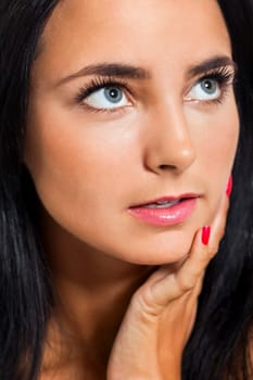 Close-up of a young woman girl with black hair beauty portrait isolated against white background