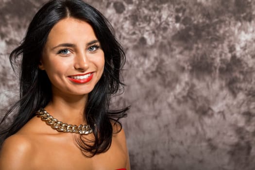 Young pretty girl woman with long black hair in red top as portrait with text space
