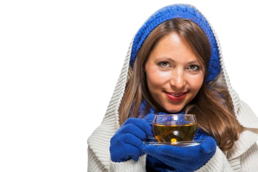 Young woman with dark hair and blue wool lyant drink a cup of tea to be isolated on white background