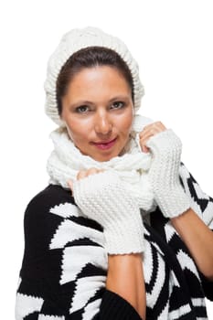 attractive young woman with white wool hat and knitted sweater scarf gloves with dark hair laughing isolated on white background
