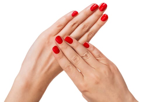 Women's hands with beautiful well-groomed fingers and red nail polish wellness beauty spa close up isolated on white background