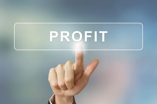 business hand pushing profit button on blurred background