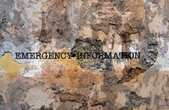 Emergency information text on wall