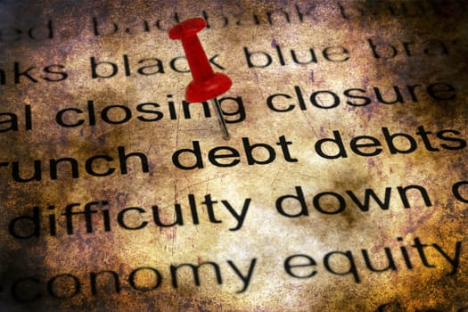 Push pin on debt concept