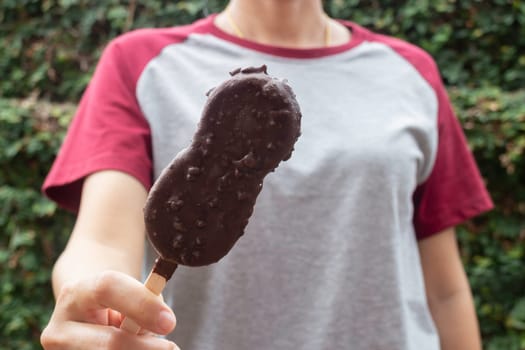 Ice cream covered with chocolate and nuts, stock photo