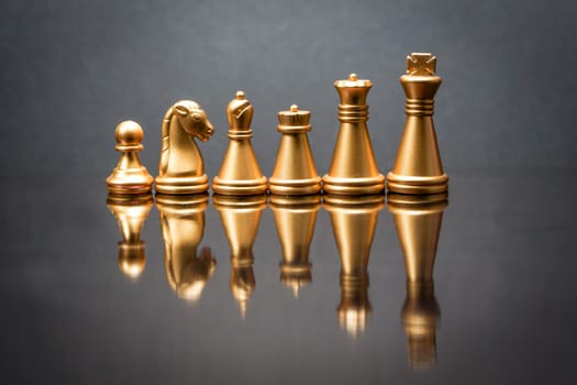 Stacking Piece of chess, king, queen, knight, castle, bishop and  pawn or apieces with reflection glass on black background. Chess game, business, competition, leadership and success concept