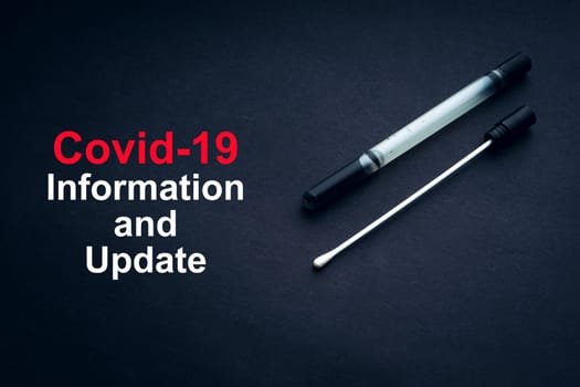 COVID-19 or CORONAVIRUS INFORMATION AND UPDATE text with medical swab on black background. Covid-19 or Coronavirus concept.