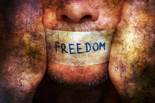Man with freedom tape over mouth