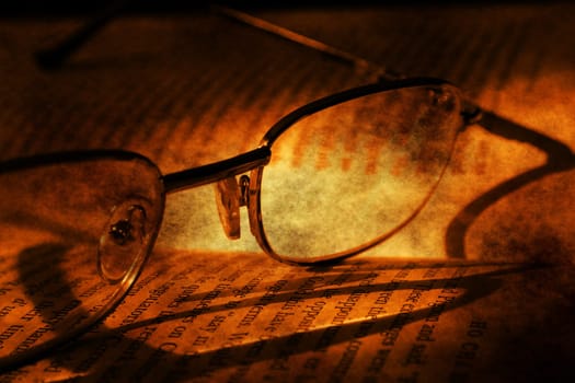 Book and glasses grunge concept