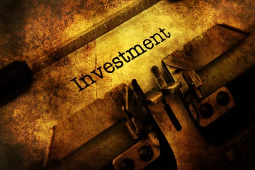 Investment text on typewriter grunge concept