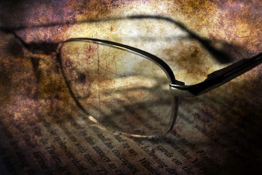 Book and glasses grunge concept