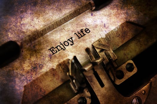 Enjoy life text on vintage typewriter