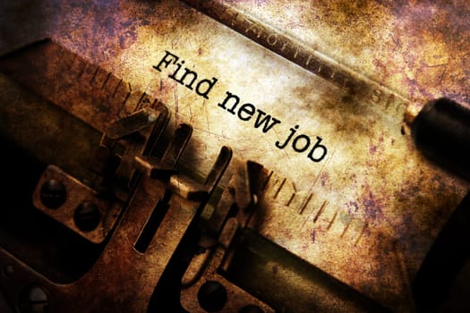 Find new job text on typewriter