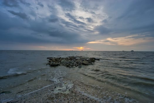 Peaceful beach view and waves during sunset at Jeram, Kuala Selangor Malaysia