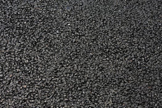 Background texture of road construction material asphalt.
