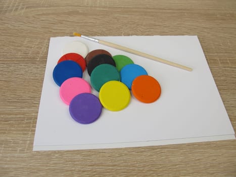 Water-soluble watercolor color tablets - Colorful watercolor, a drawing pad and a brush