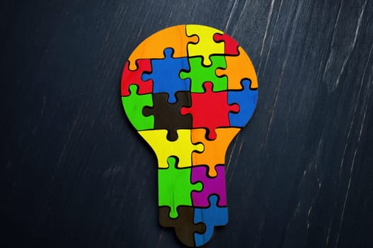 Diversity and creativity concept. Colored pieces of the puzzle in the shape of a bulb.