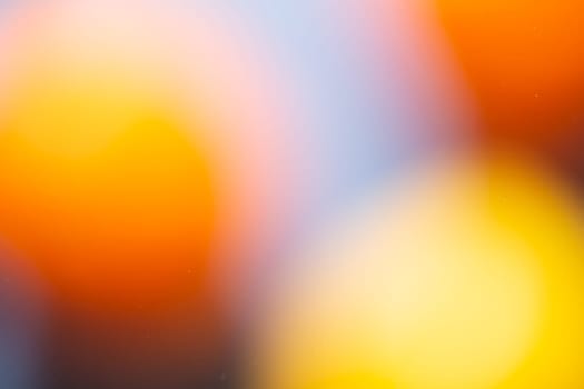a Close-up water and oil abstract in a rainbow lighting effect