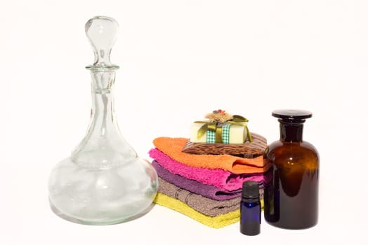 soap on top of facecloths of various shades with bottles