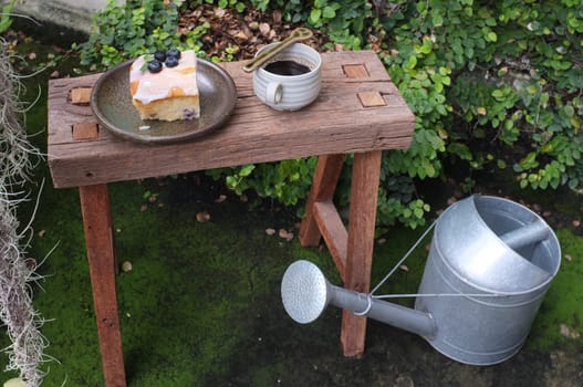 Coffee with piece of cake on wooden table , Concept Relax time, Copy space. Place for text.