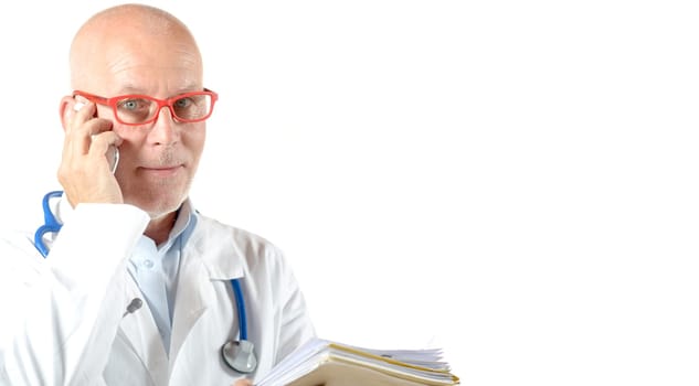 portrait of mature doctor with phone isolated on white background