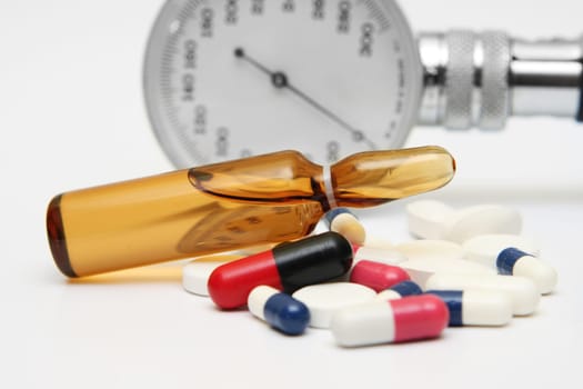 Pills and medicine vial