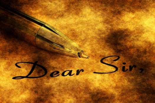 Fountain pen on dear sir text