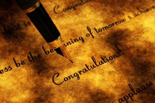 Fountain pen on congratulation text