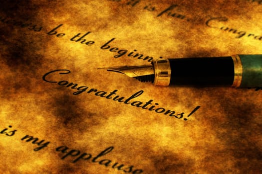 Fountain pen on congratulation text