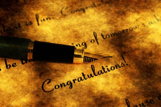 Fountain pen on congratulation text